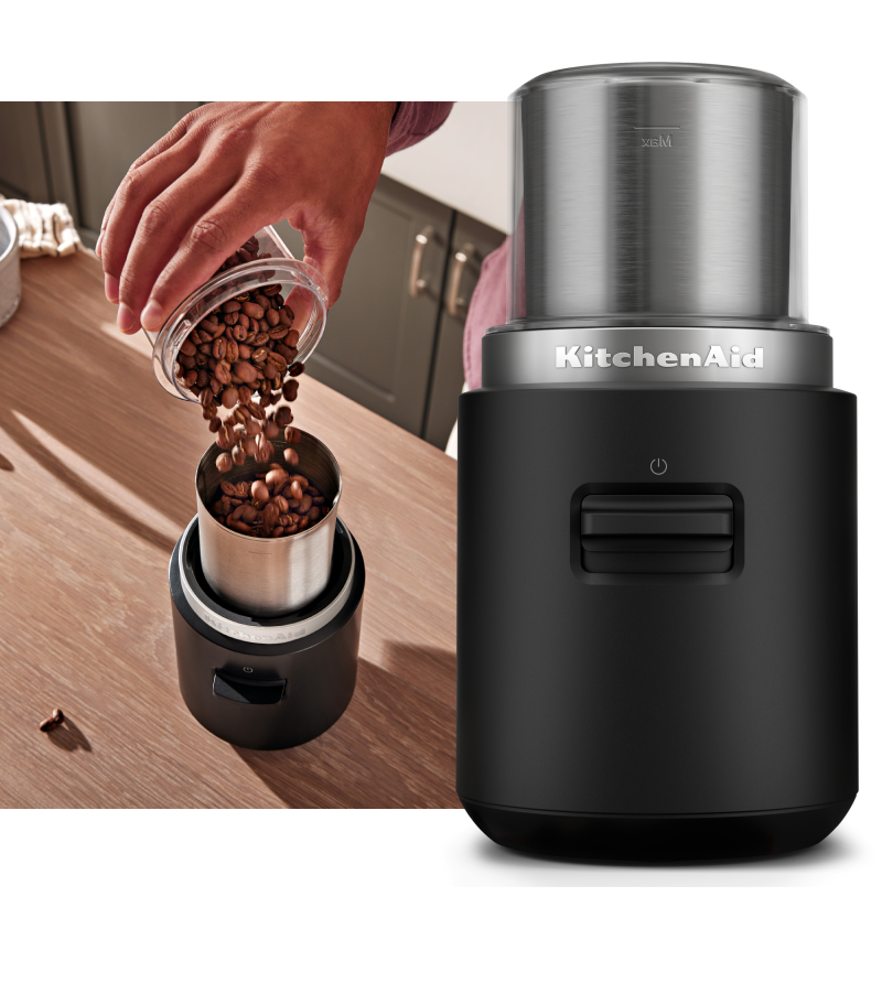   KitchenAid Go™ Cordless Blade Grinder and a person pouring coffee beans into the grinder.