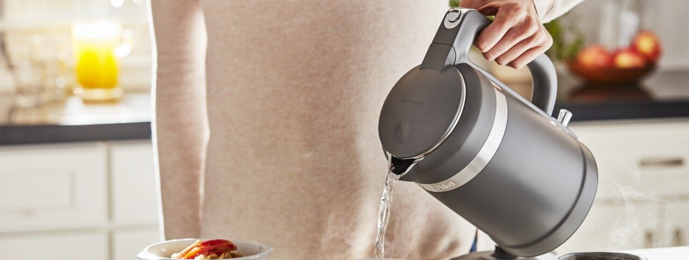 Person pouring from a kettle