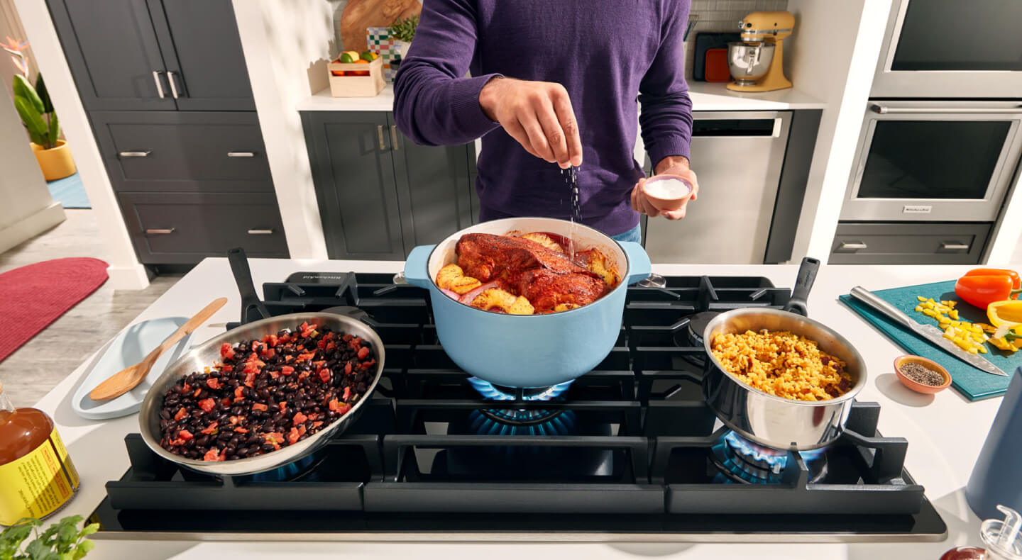 Person cooking on a gas range