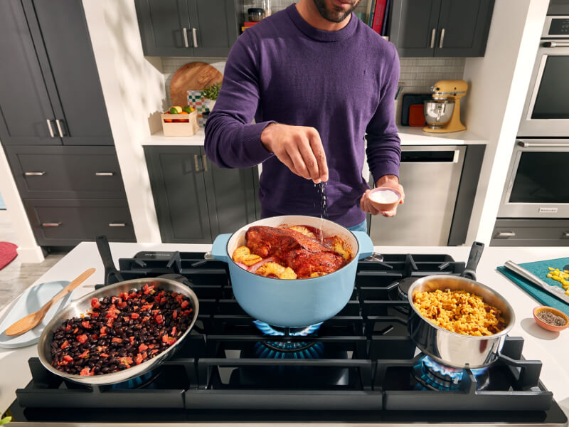 Person cooking on a gas range