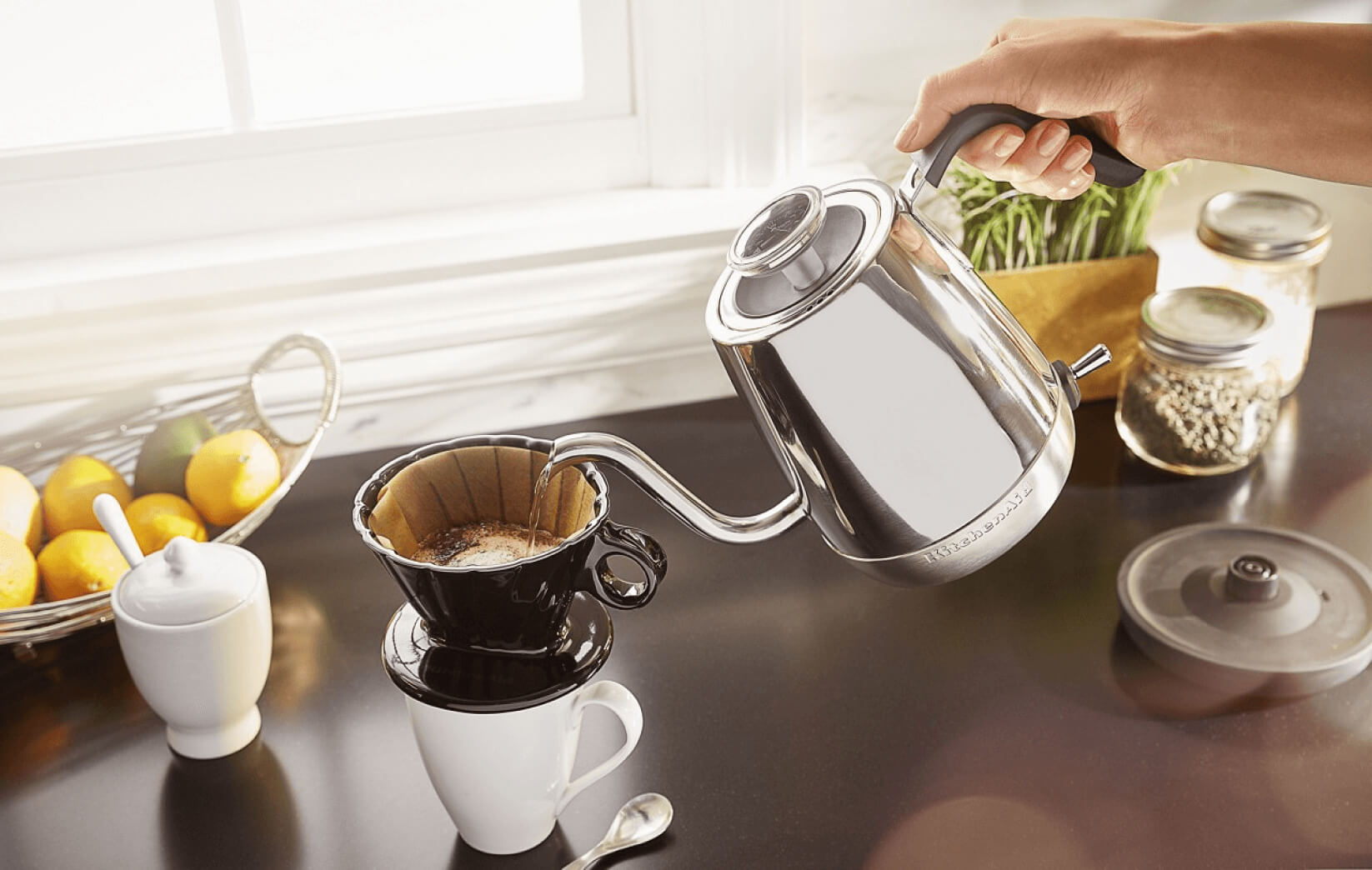 Three KitchenAid® Precision Gooseneck Kettles resting on a kitchen counter.