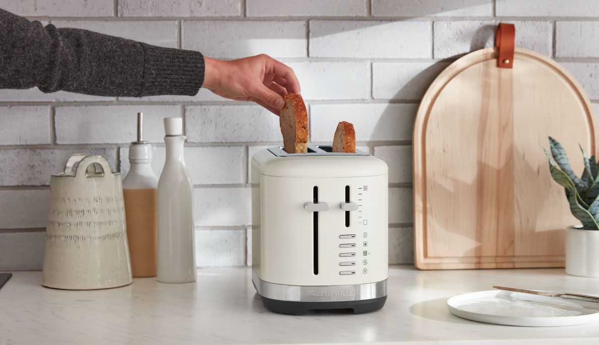 A KitchenAid® toaster with bagels inside.
