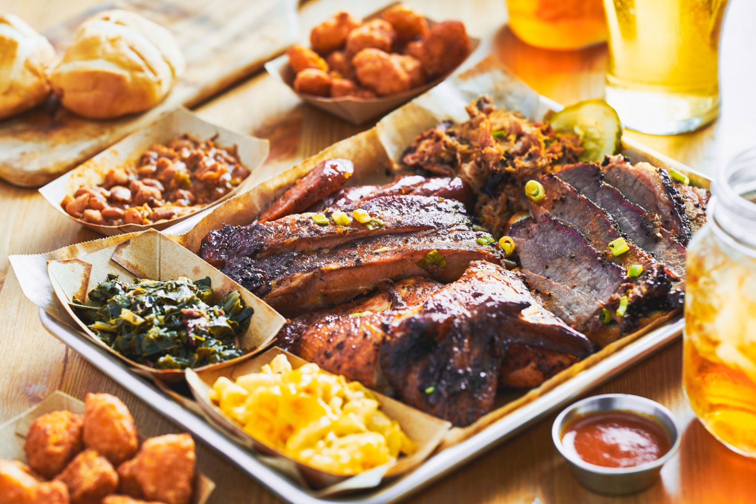 A silver tray filled to the brim with a variety of soul foods.
