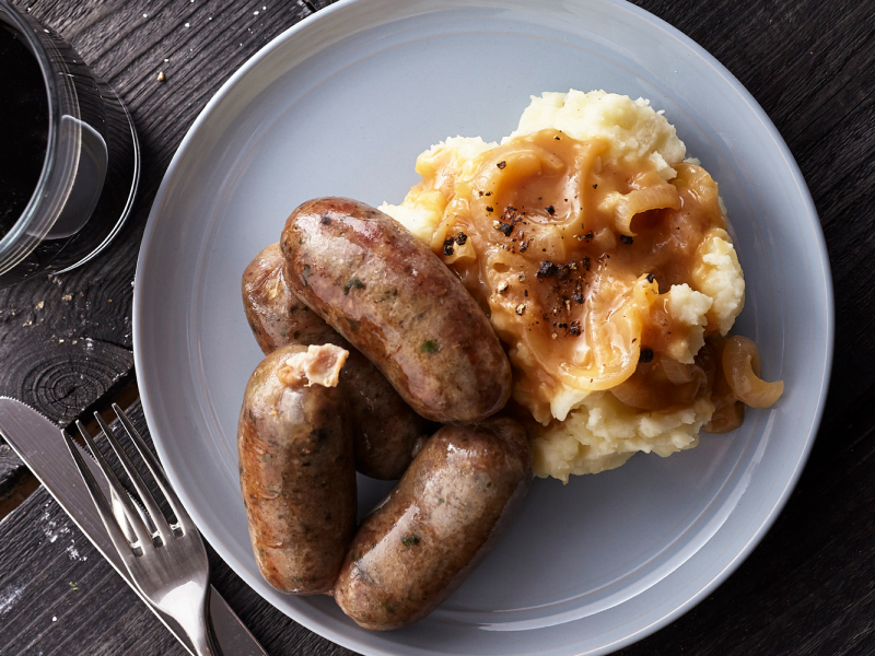Sausage and mashed potatoes covered with gravy