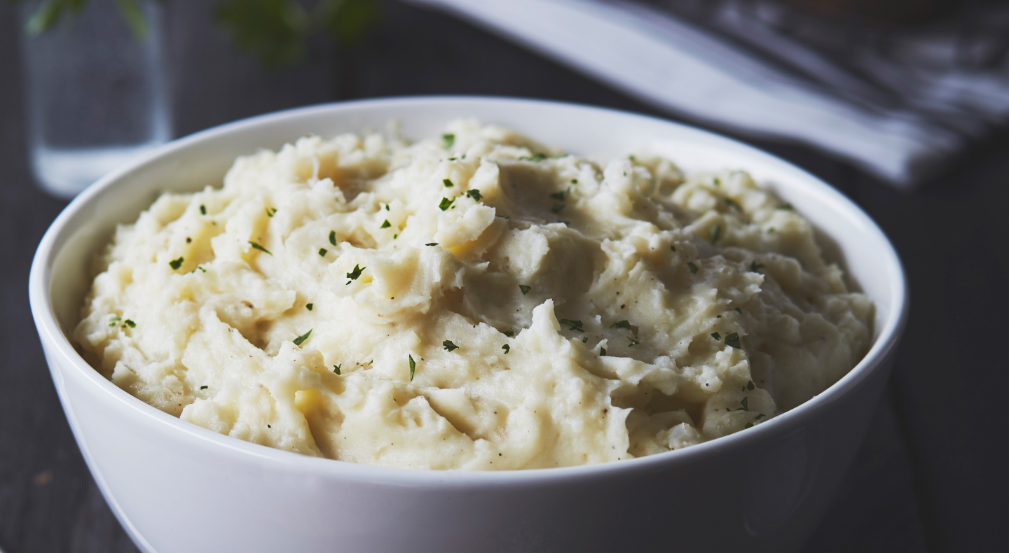 Mashed potatoes in white bowl