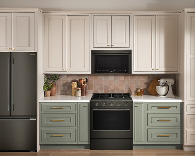 KitchenAid® refrigerator, over-the-range microwave and gas range suite in Juniper
