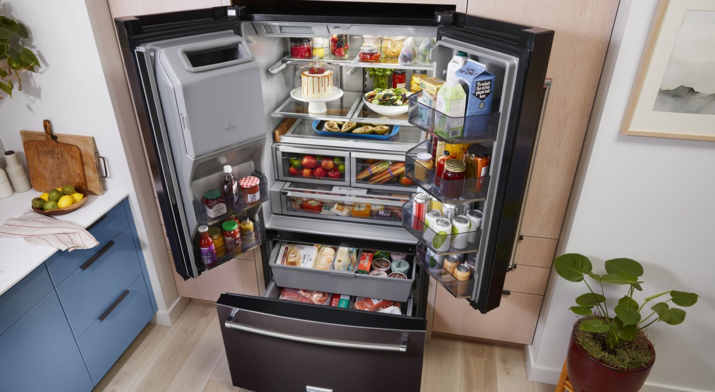 Bird’s-eye view of black stainless French door refrigerator stocked with food