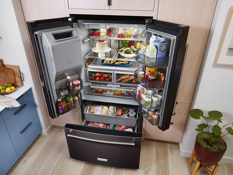 Bird’s-eye view of black stainless French door refrigerator stocked with food