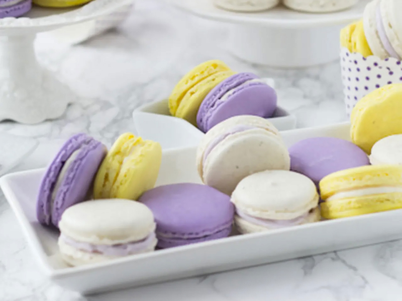 Lavender honey macarons on a serving tray. 