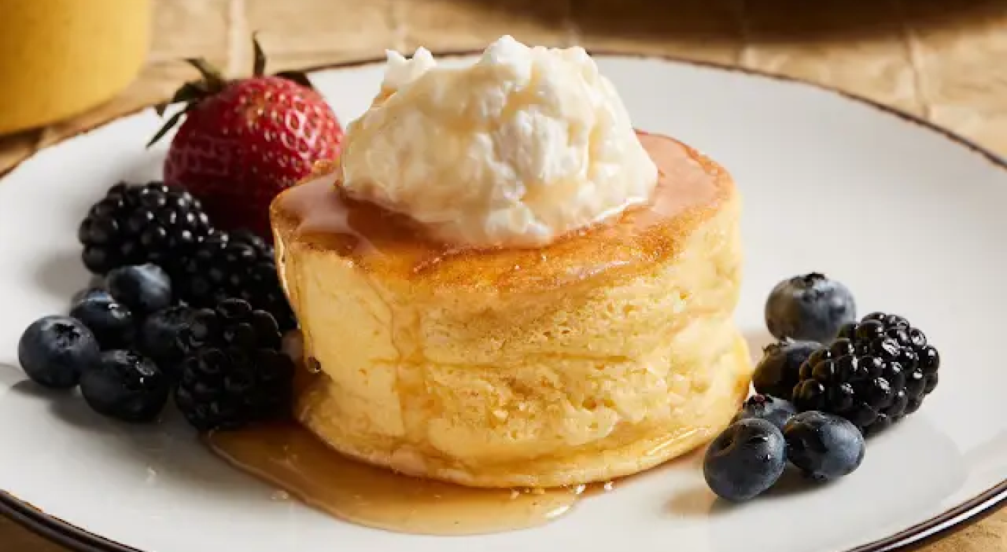 Single-serve souffle on plate with fruit