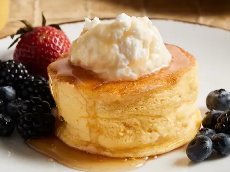 Single-serve souffle on plate with fruit
