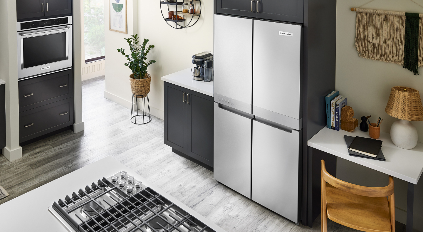 KitchenAid® 4-door refrigerator built into black cabinetry