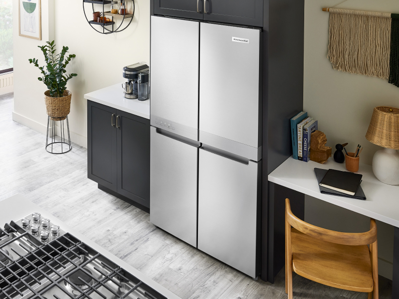 KitchenAid® 4-door refrigerator built into black cabinetry