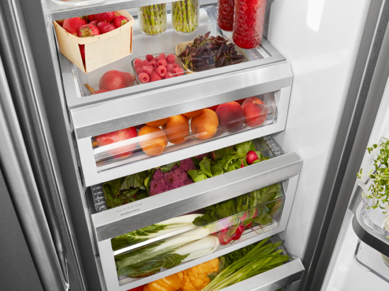 Birds-eye view of fresh product organized inside of a refrigerator