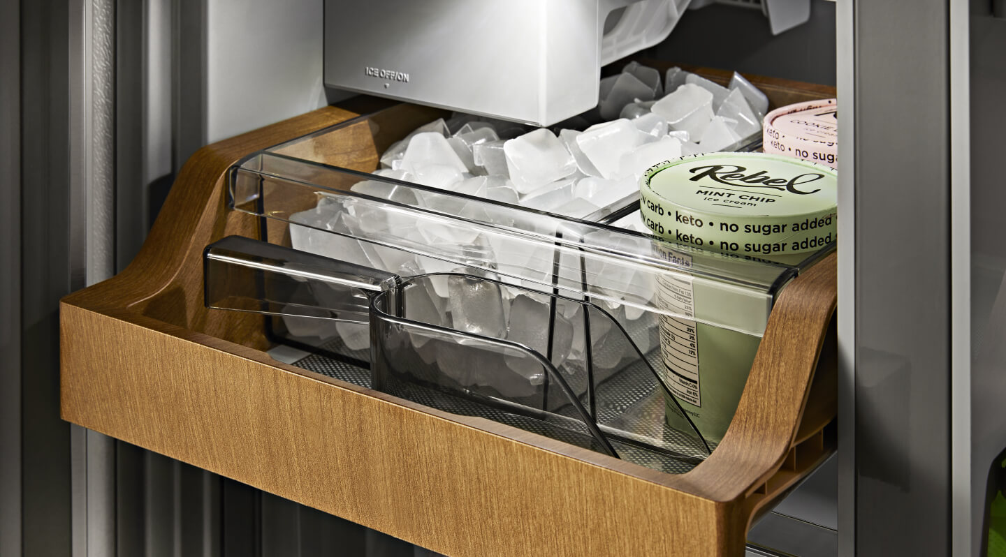 Ice and ice cream inside a wood-paneled ice compartment