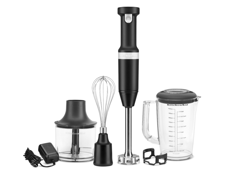 A KitchenAid® cordless hand mixer with whisk attachment.