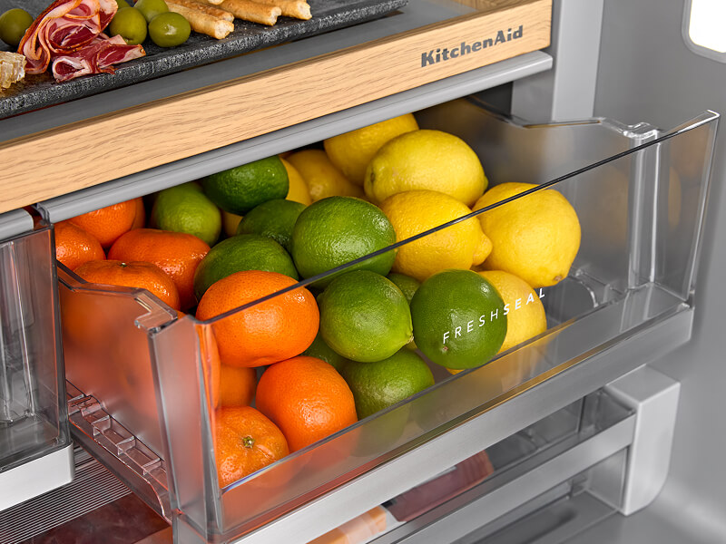 Oranges, limes and lemons stored in the refrigerator for freshness