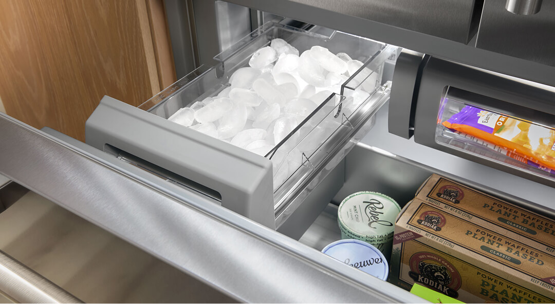 Ice bin storage in French door refrigerator freezer full of ice