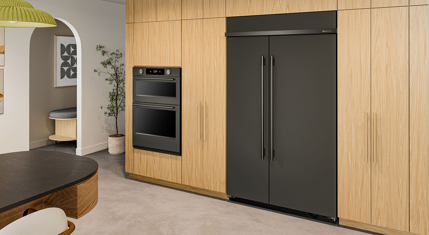 KitchenAid® built-in side-by-side refrigerator in light brown cabinetry