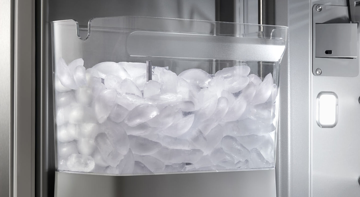 In-door ice maker bin full of ice