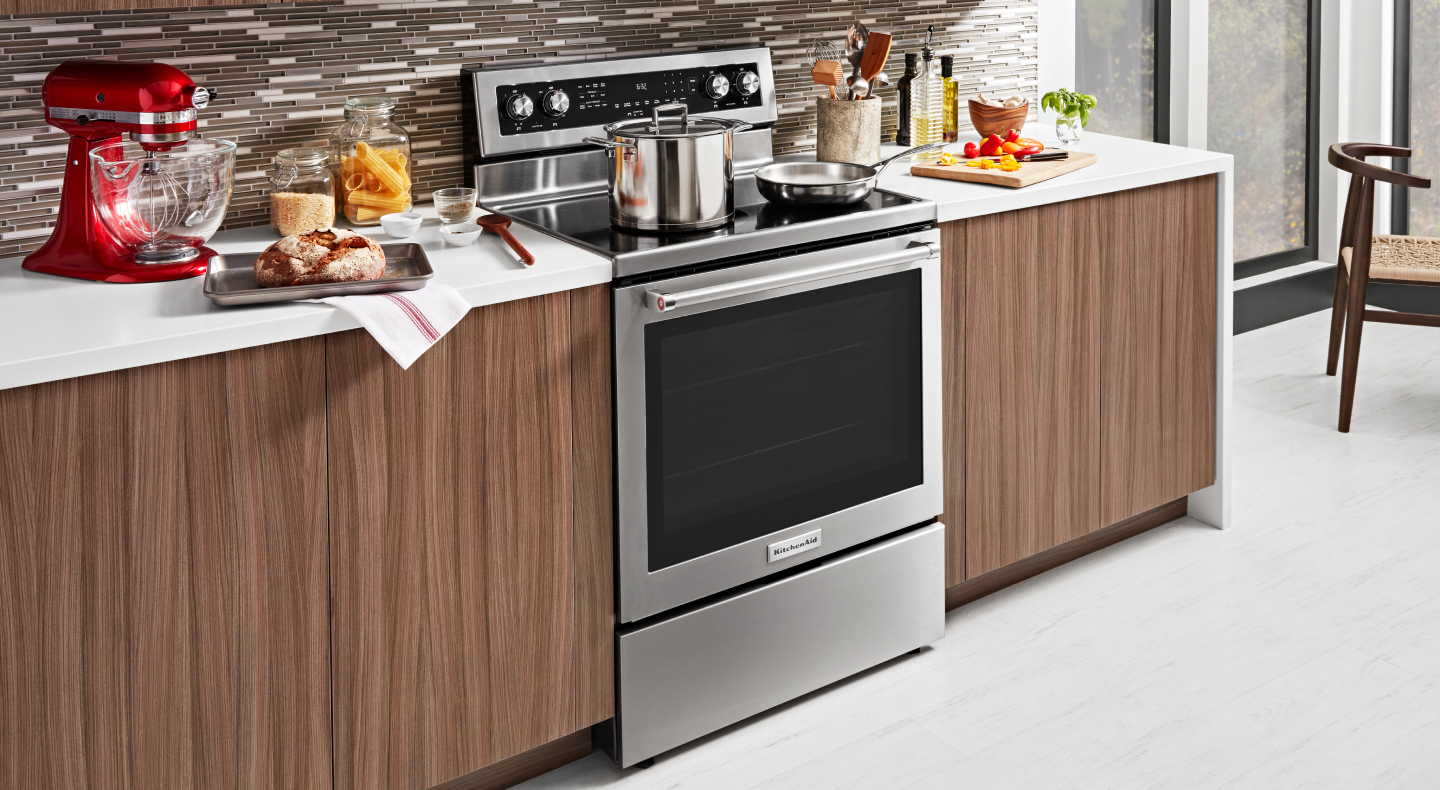 KitchenAid® electric range with a pot and skillet on top