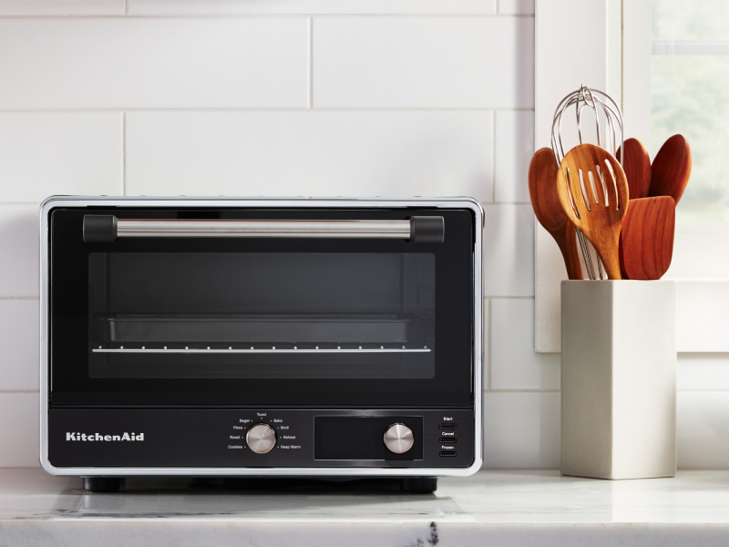 A KitchenAid® countertop oven with air fry on a modern kitchen counter. 
