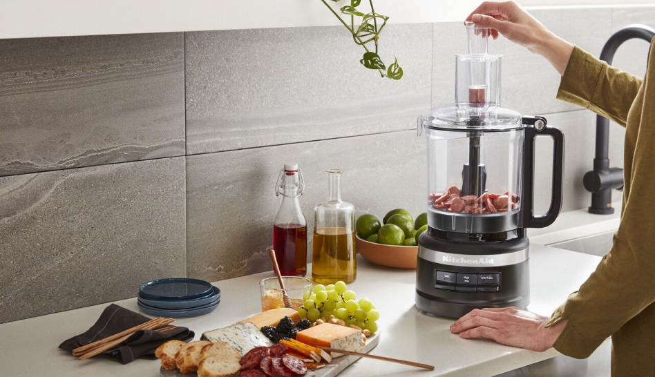 Woman using a KitchenAid® Food Processor