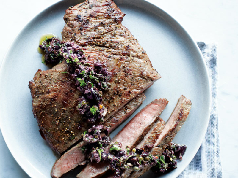 Cooked, sliced steak on a plate