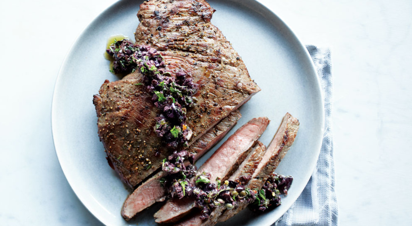Cooked, sliced steak on a plate