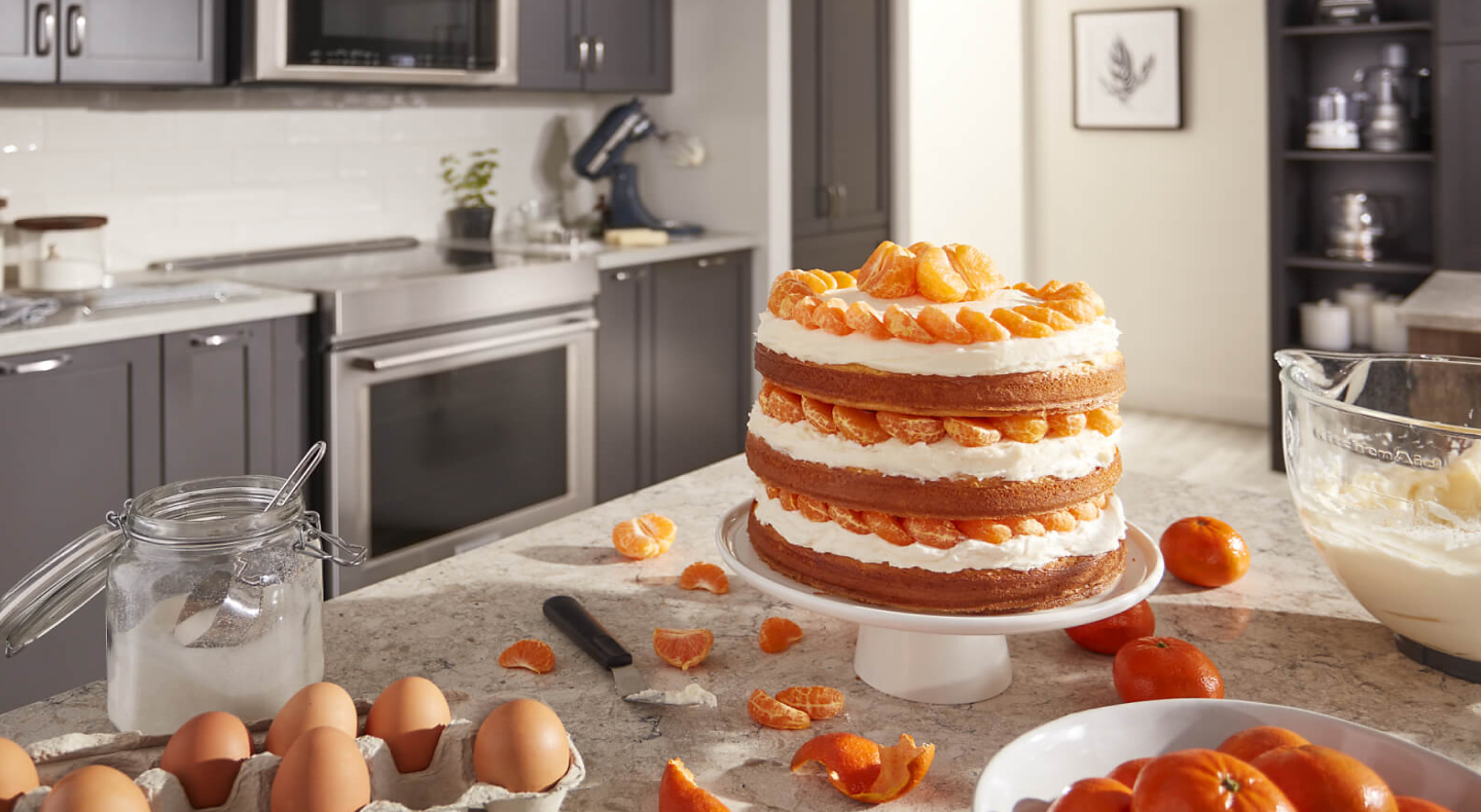 Three layer orange cake on a counter