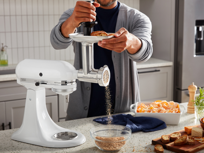 Person using KitchenAid® stand mixer to grind bread