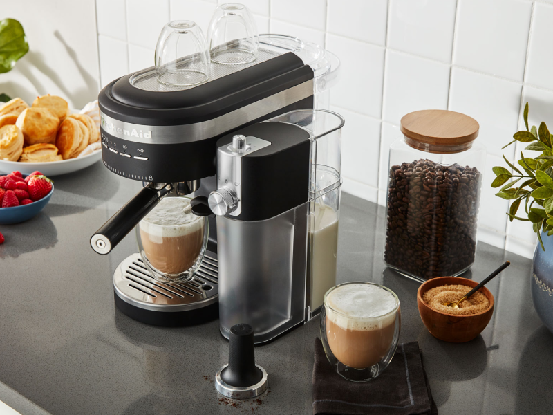 Espresso machine and milk frother on countertop with café style drinks