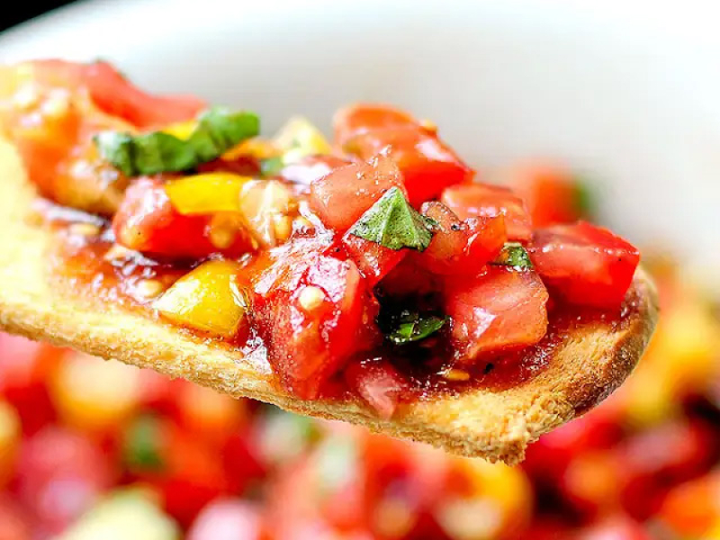 Bruschetta on a thin piece of bread.