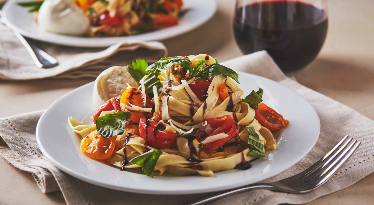 Homemade fettuccine with tomatoes and fresh herbs