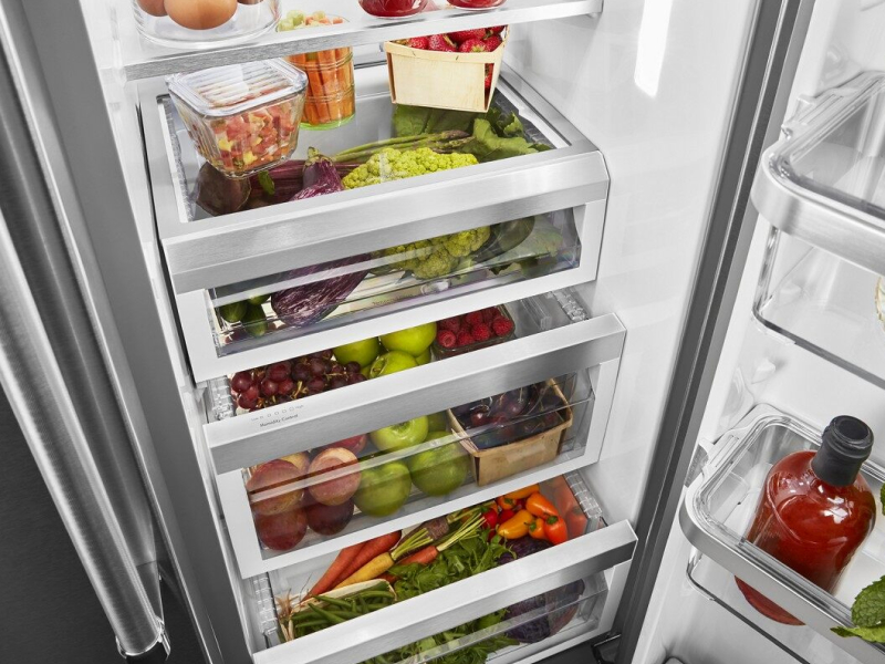 A refrigerator filled with salsa ingredients and other fresh foods