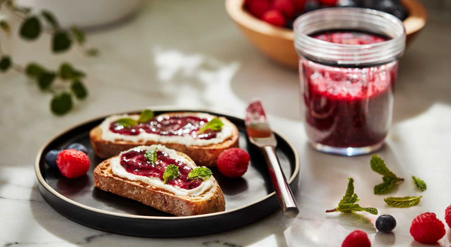 Slices of toast topped with fruit preserves and cheese