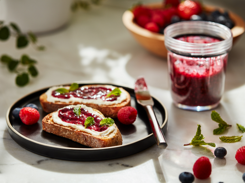Slices of toast topped with fruit preserves and cheese