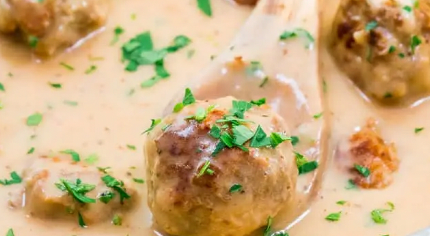 Swedish meatball on wooden spoon