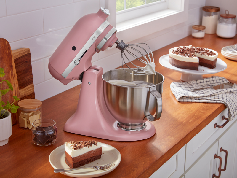 Homemade whipped cream in a pink KitchenAid® stand mixer