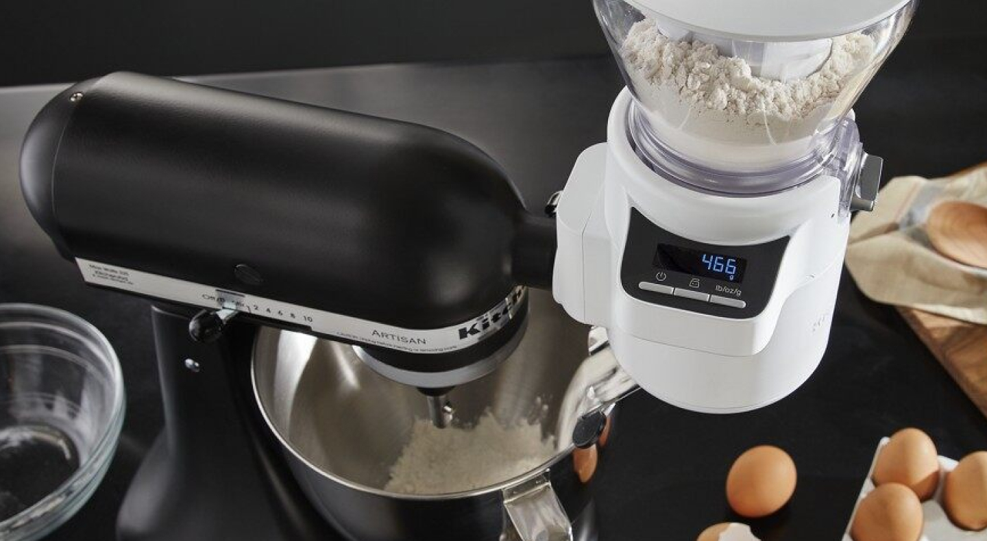 Birds-eye view of a black KitchenAid® stand mixer and attached KitchenAid® Sifter + Scale Attachment 