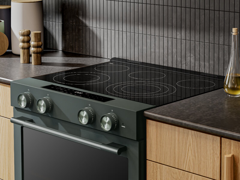 A KitchenAid® slide-in range with wood cabinetry