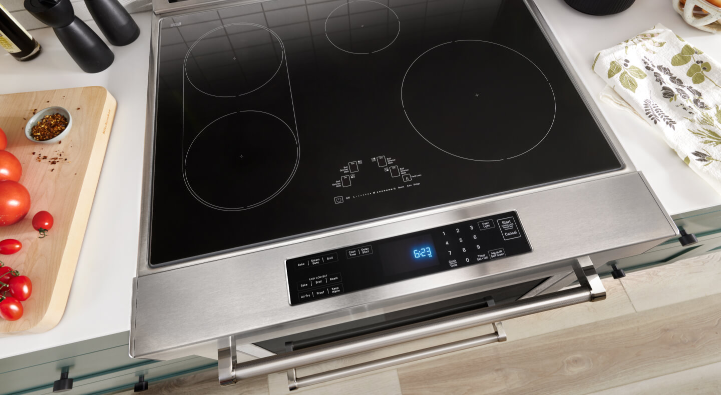 The smooth glass cooktop on top of a range