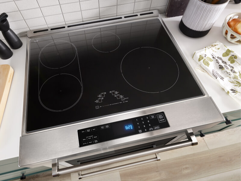 The smooth glass cooktop on top of a range