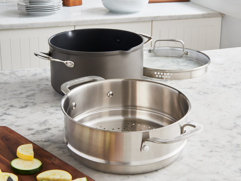 A pot with a metal steaming basket