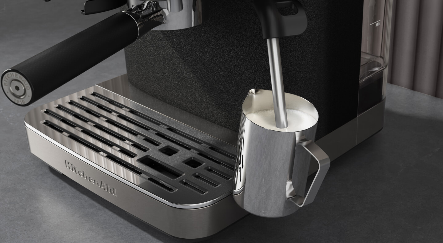 Milk being frothed with a steam wand