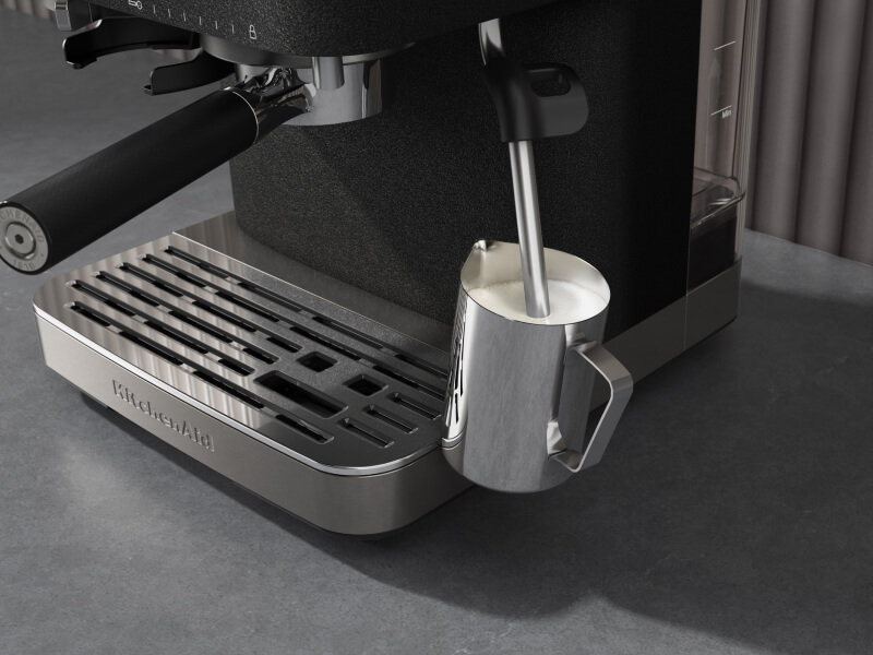 Milk being frothed with a steam wand