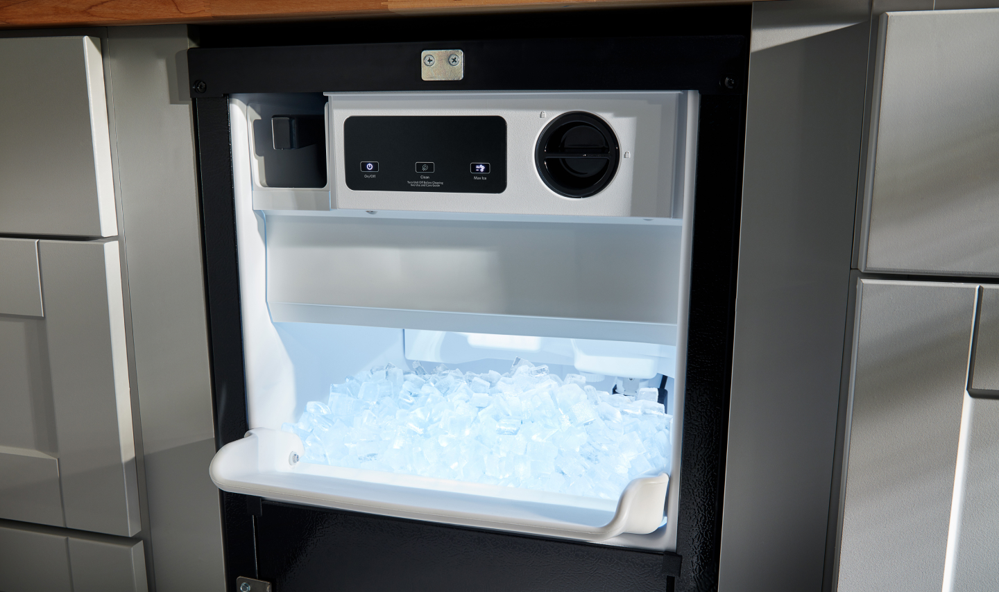 An open ice maker drawer