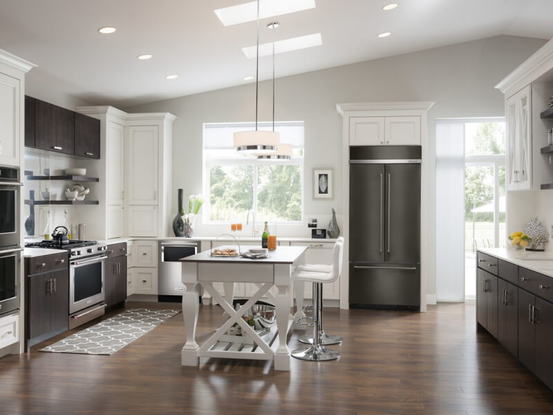 A kitchen with an island table and stool seating