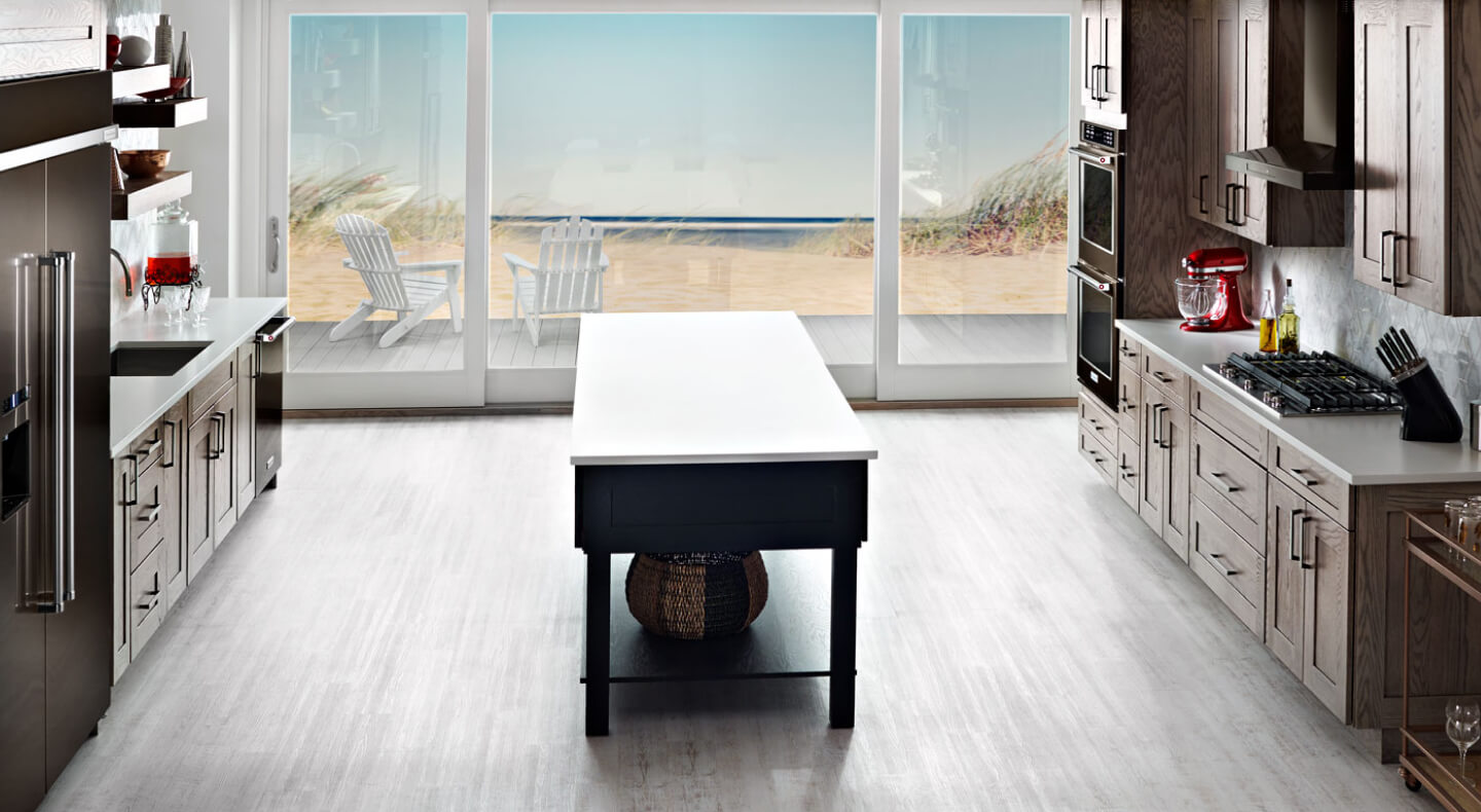 A large galley-shaped kitchen with an island