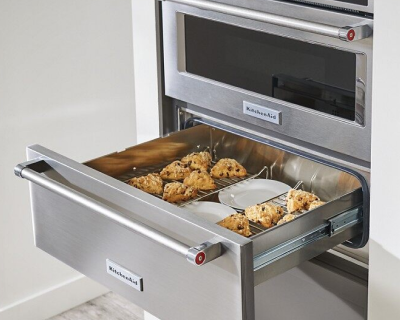 Foods being kept warm in an open warming drawer